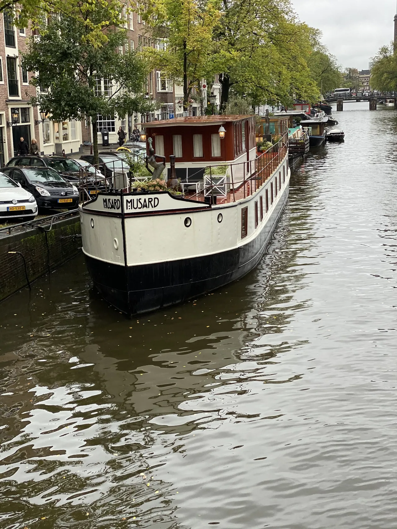 A large canal boat on an Amsterdam canal.